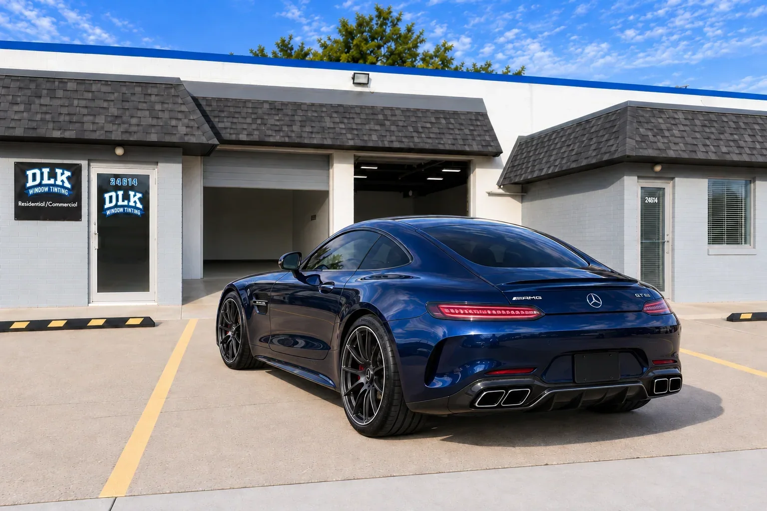 Blue Mercedes-AMG GT with tinted rear glass outside the DLK unit